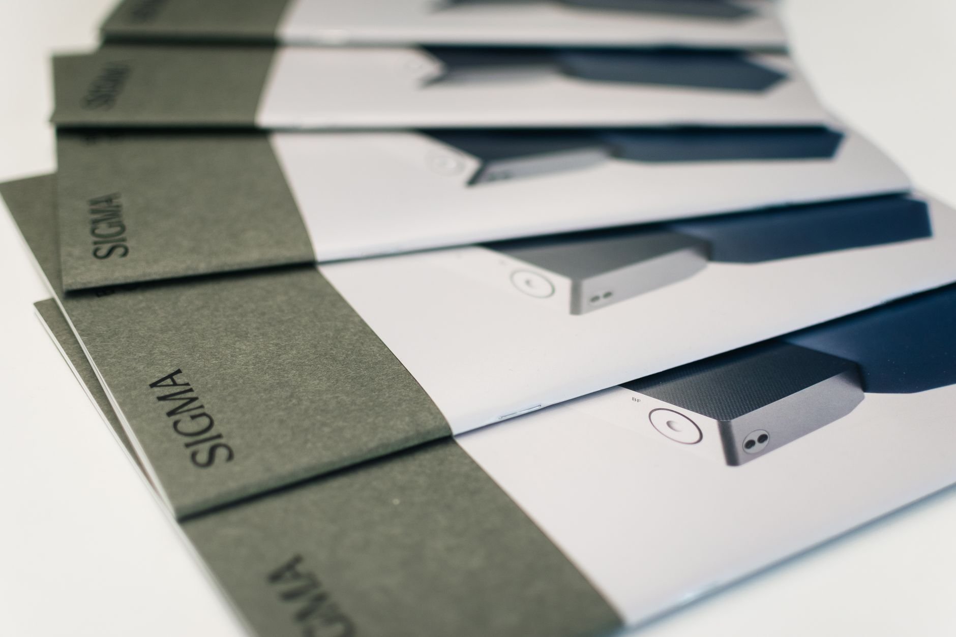 Close-up of folded brochures showcasing product images and layout design
